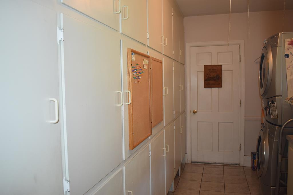 Laundry with lots of storage cabinets